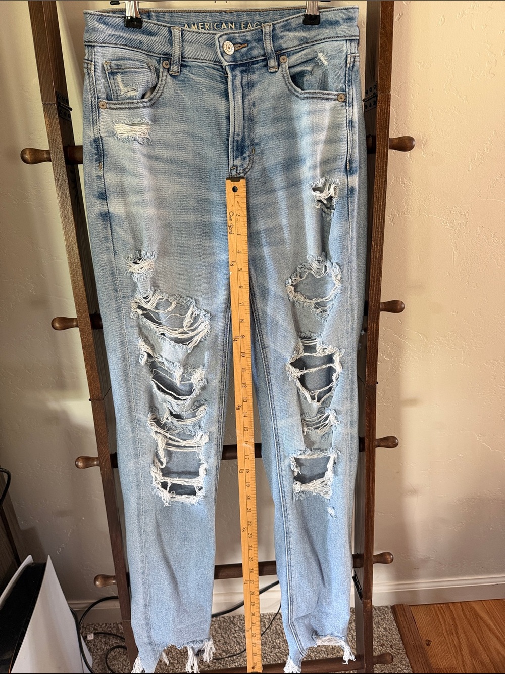 American Eagle light blue denim jeans with branded button and belt loops